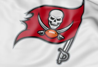 Close-up of waving flag with Tampa Bay Buccaneers NFL American football team logo, 3D rendering